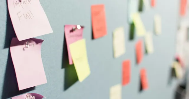 Paper notes on a wall